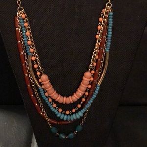 Necklace & earrings, different lengths of beads.